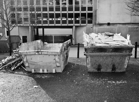 Construction workers managing waste clearance on-site in Anerley