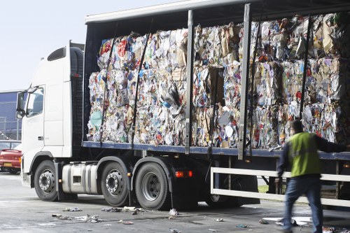 Trucks collecting construction debris